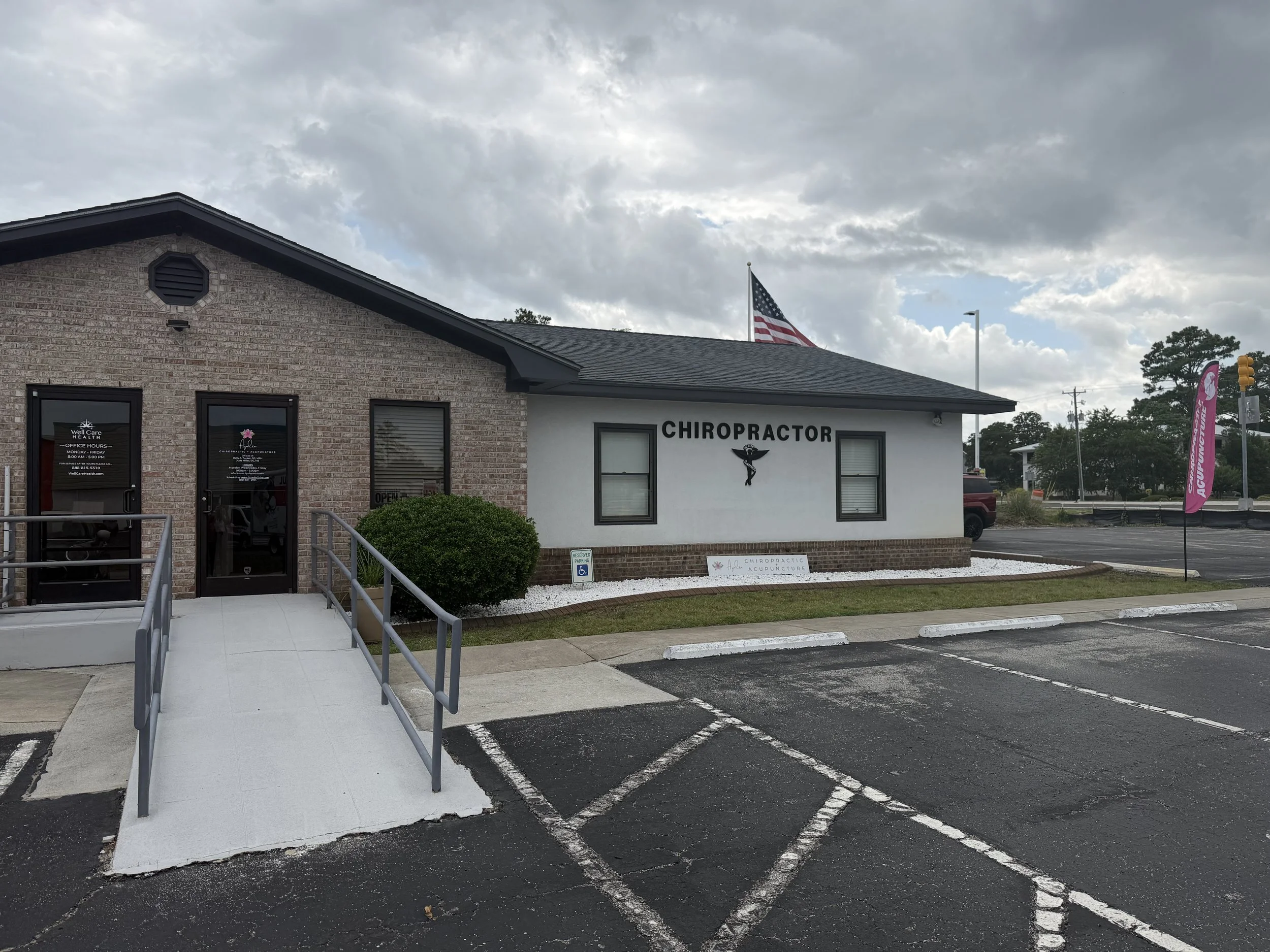 Exterior building, parking lot and handicap accessible ramp