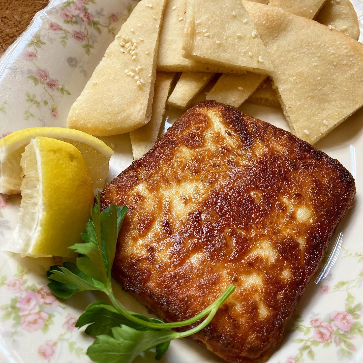 Saganaki is back! Kaseri cheese coated in flour (for that crispy crust) pan seared and flamb&eacute;ed with Ouzo&mdash;served with lemon and a side of our house made lagana flat bread 🤤 🧀 🫓 

We are open 9:30-6:30 today for dine in until 3, and ca