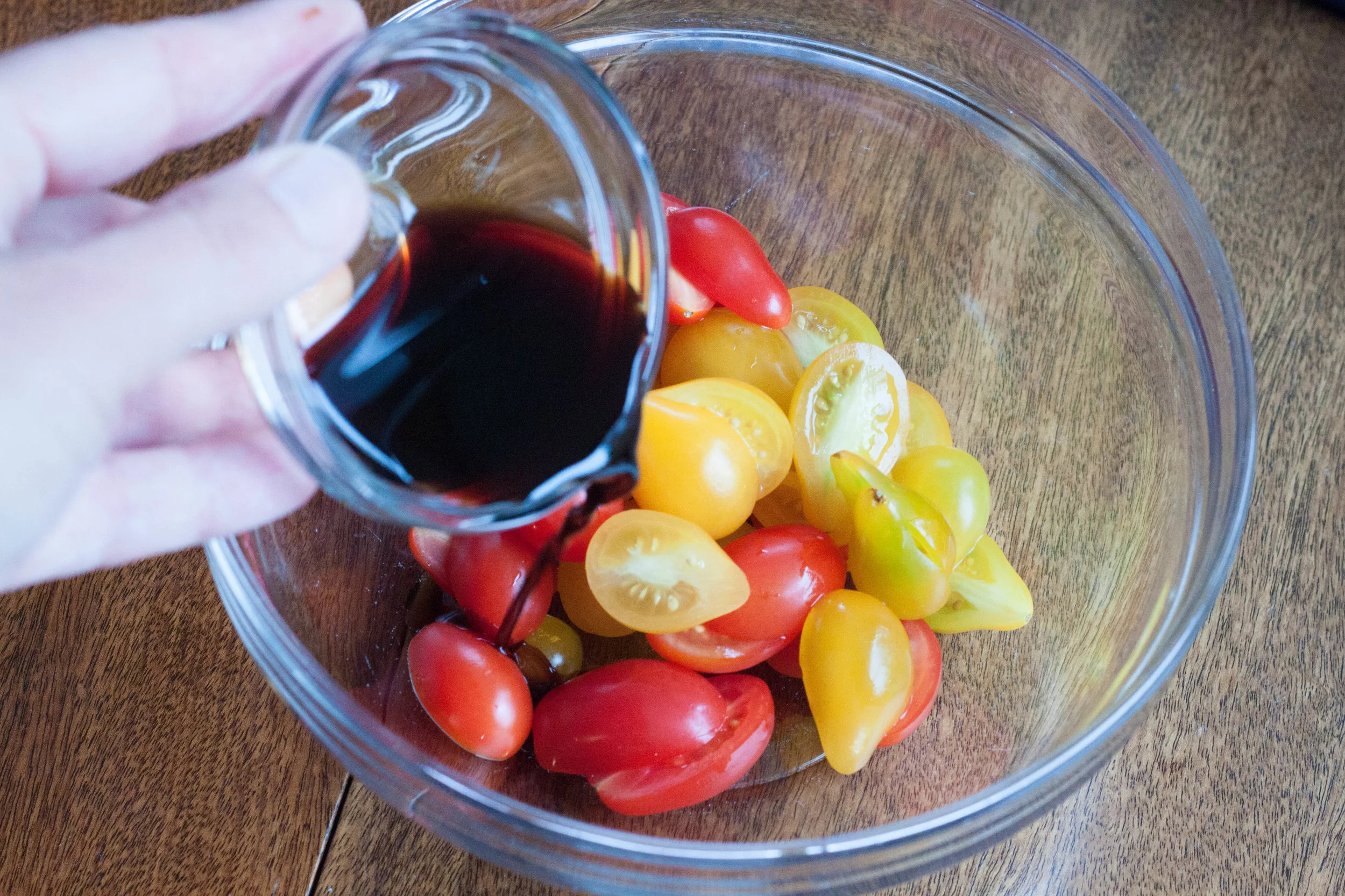 adding-balsamic-vinegar-to-cherry-tomatoes.jpg