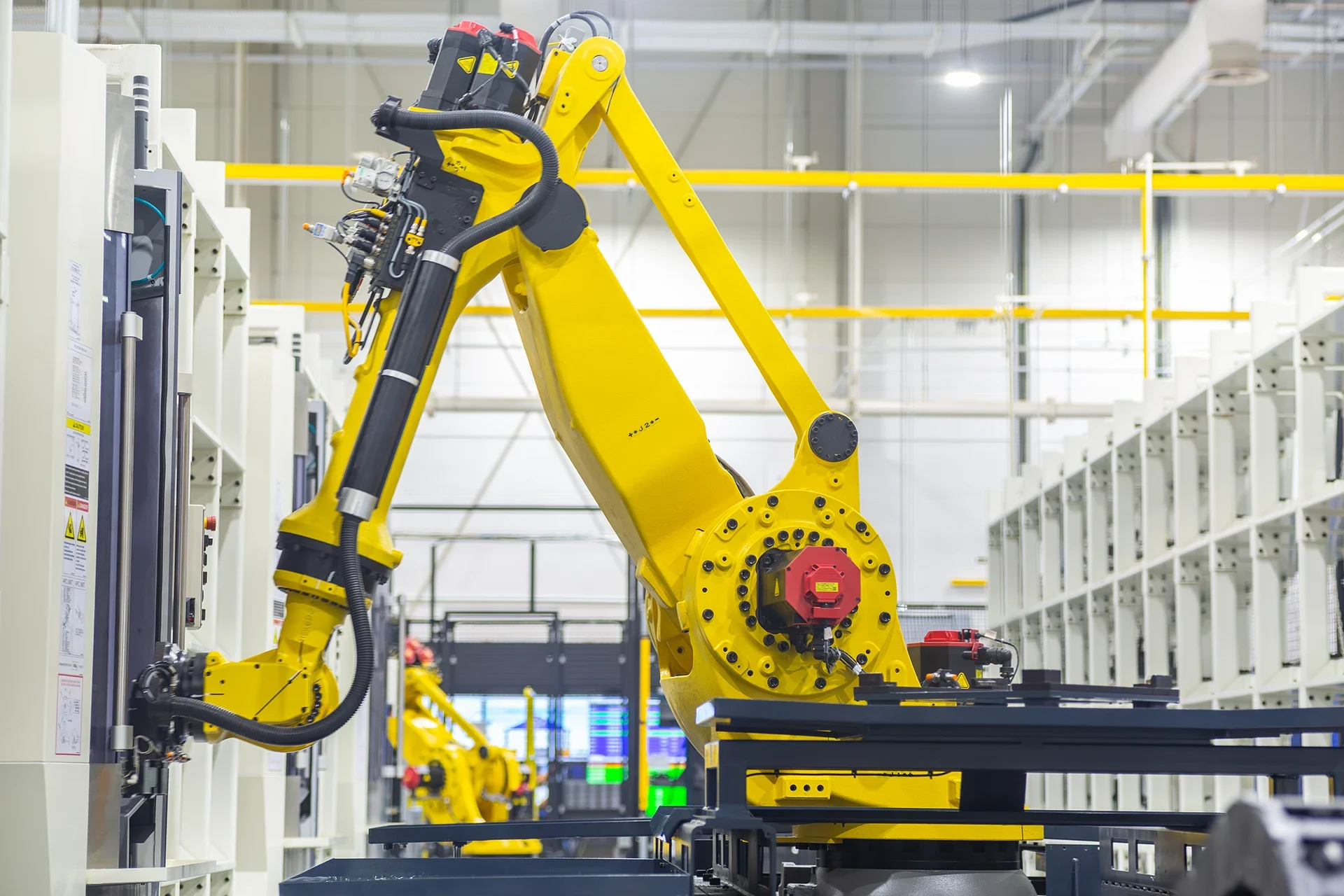 Industrial robot arm in work to handle sensitive equipment 