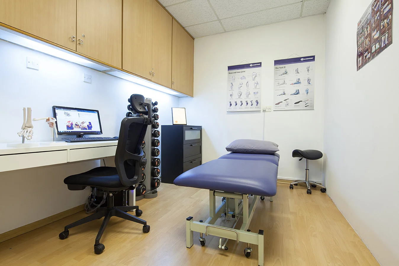 Secondary chiropractor room with massage table.