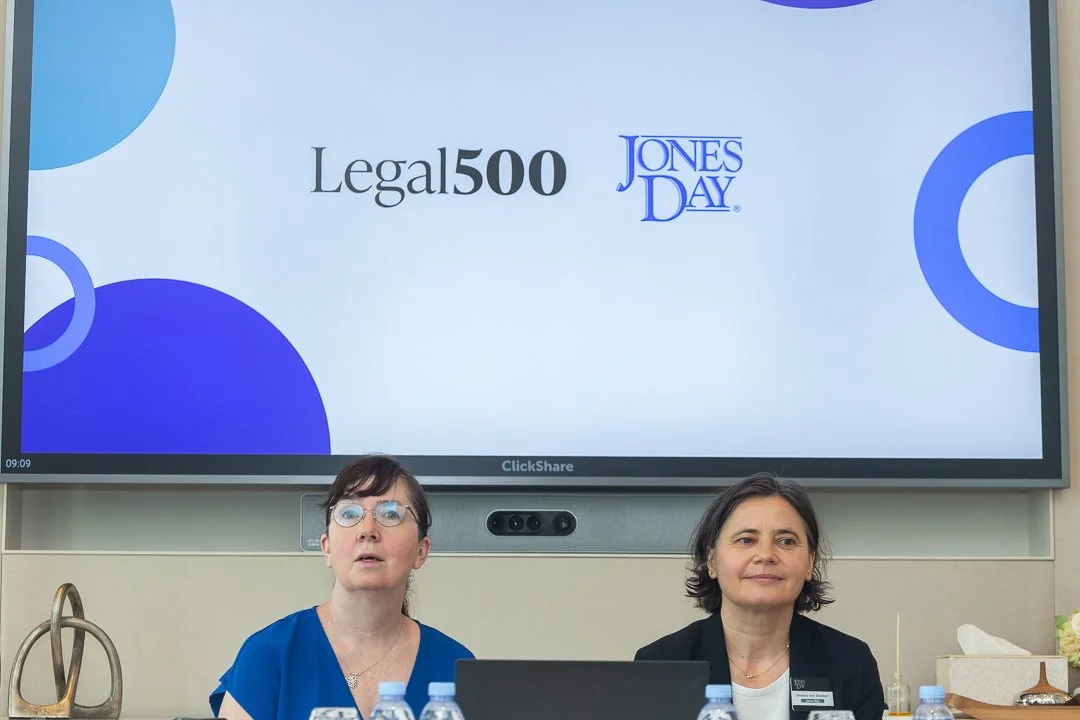 Photojournalistic feel of two female speakers and branding on the tv