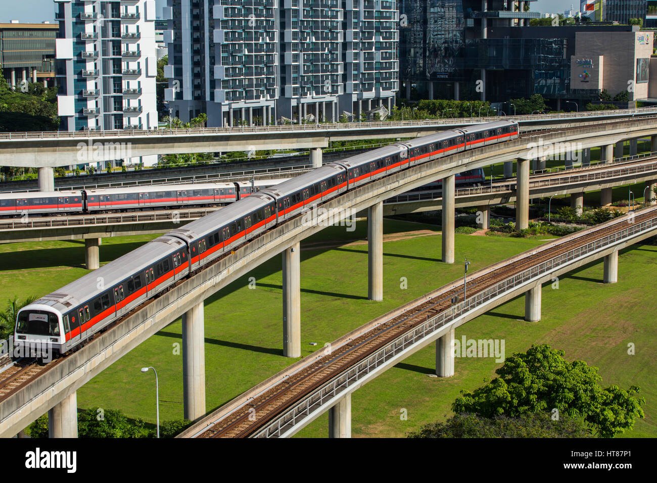 Elevated view of modern trains traveling on railway tracks, Singapore.