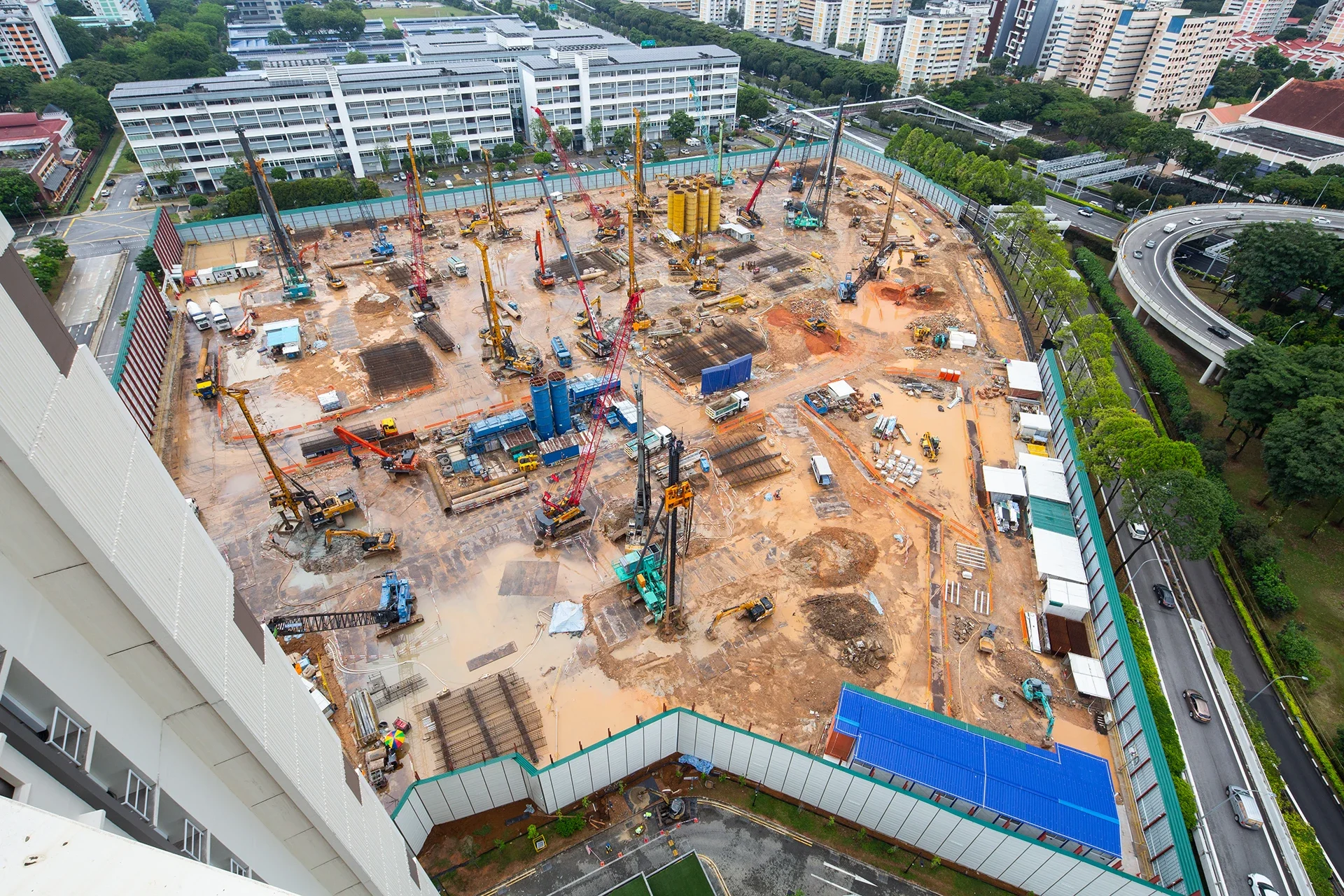 Aerial view of a construction site with ongoing activity. A perfect viewpoint to showcase monthly progression and capabilities.