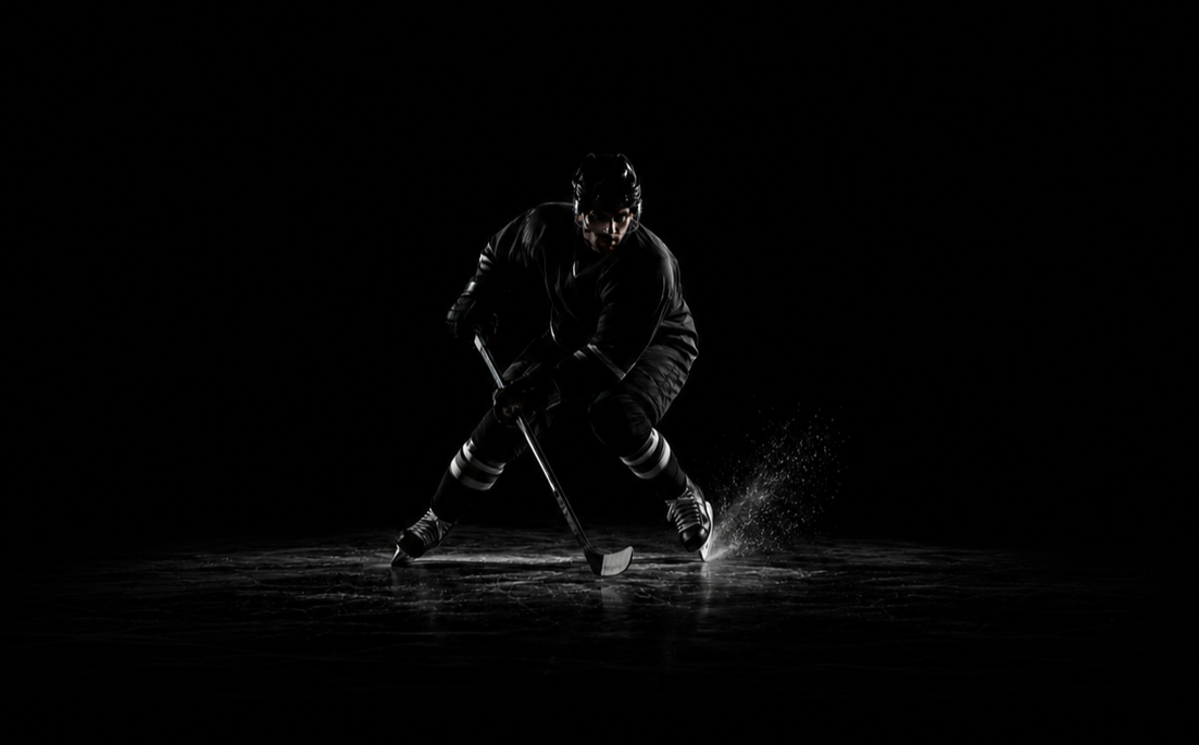 Hockey player skating with a puck, representing the Play Hockey Longer workshop by Avos Strength in Vancouver