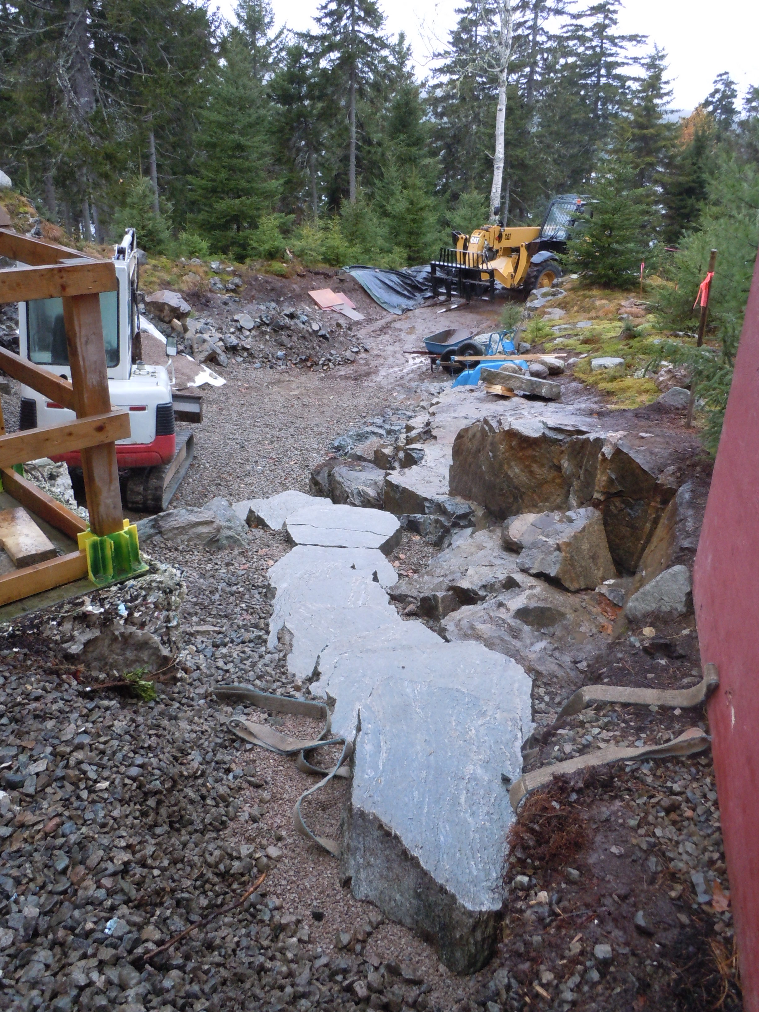   Southwest Harbor ME  - After extensive removal of ledge we were able to build this set of stairs. Prepping surrounding area to naturalize with mosses and lichens. 