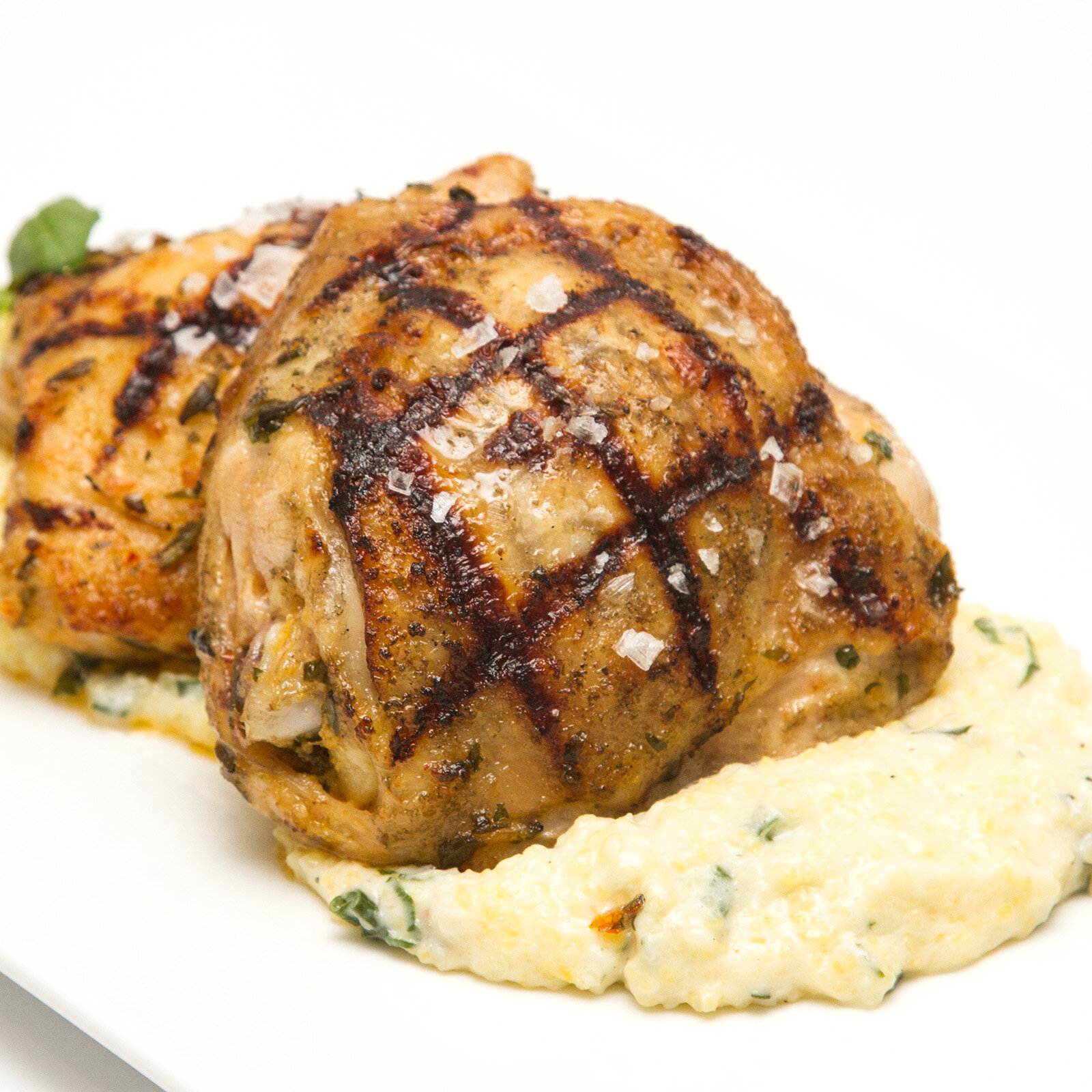 Grilled Calabrian Chile Chicken Thighs With Creamy Polenta