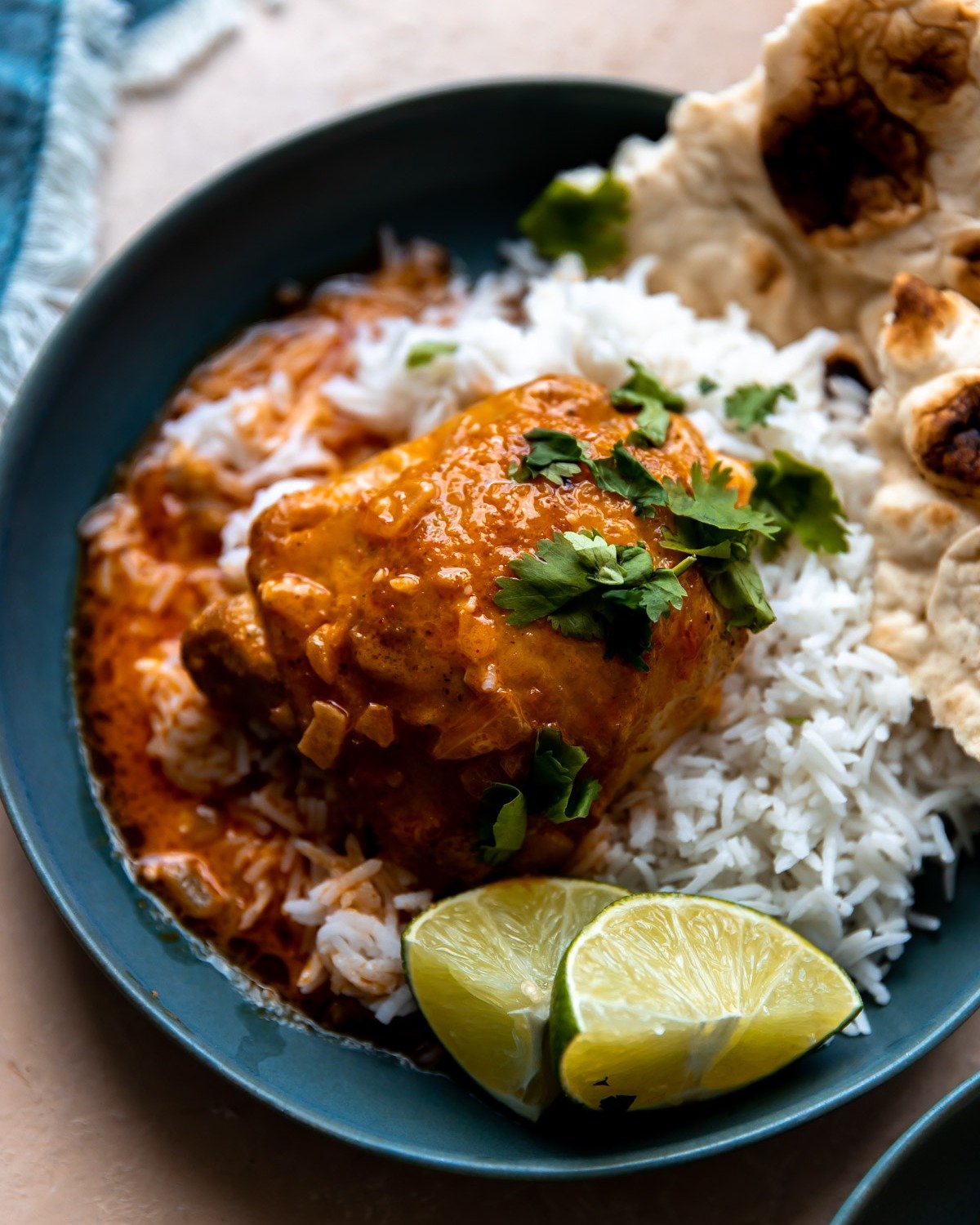 Bring a flavor-loaded chicken dinner to the table with these Coconut Curry Chicken Thighs! These chicken thighs are seared until golden brown and crispy and then braised in a coconut curry sauce until tender. Serve over a bed of rice and a side of na