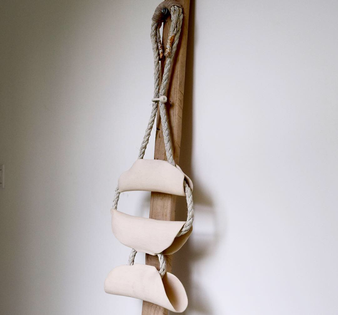 Ancestors, 2019, stoneware and rope on wood, 37 x 14 x 4 in, $1,900