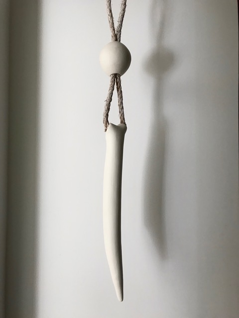 Hangbone, 2018, porcelain and rope, 35 x 3 x 3 in, $1500