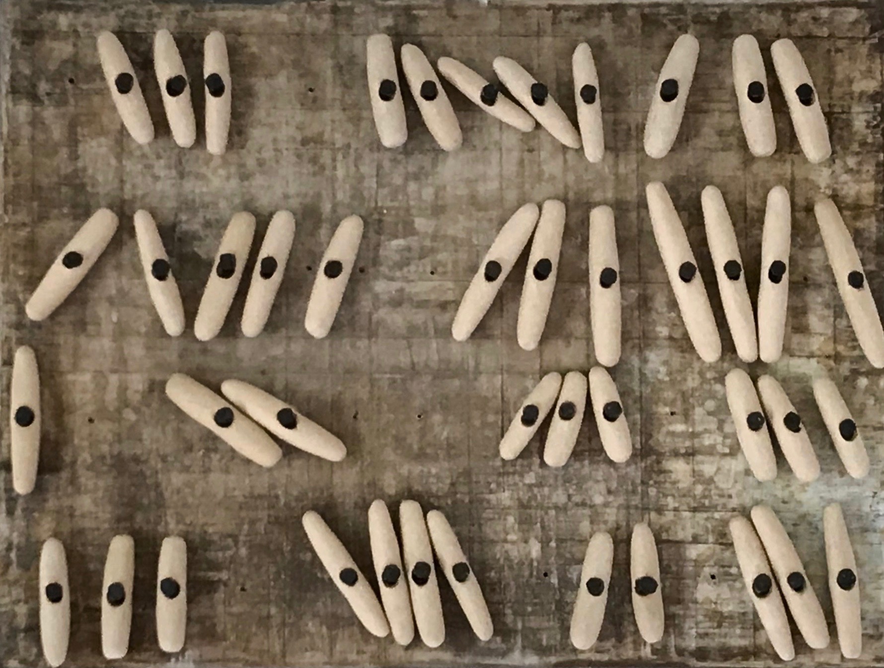 Most of Us, 2018, stoneware and iron tacks on wood, 12 x 9 x 2 in, $650