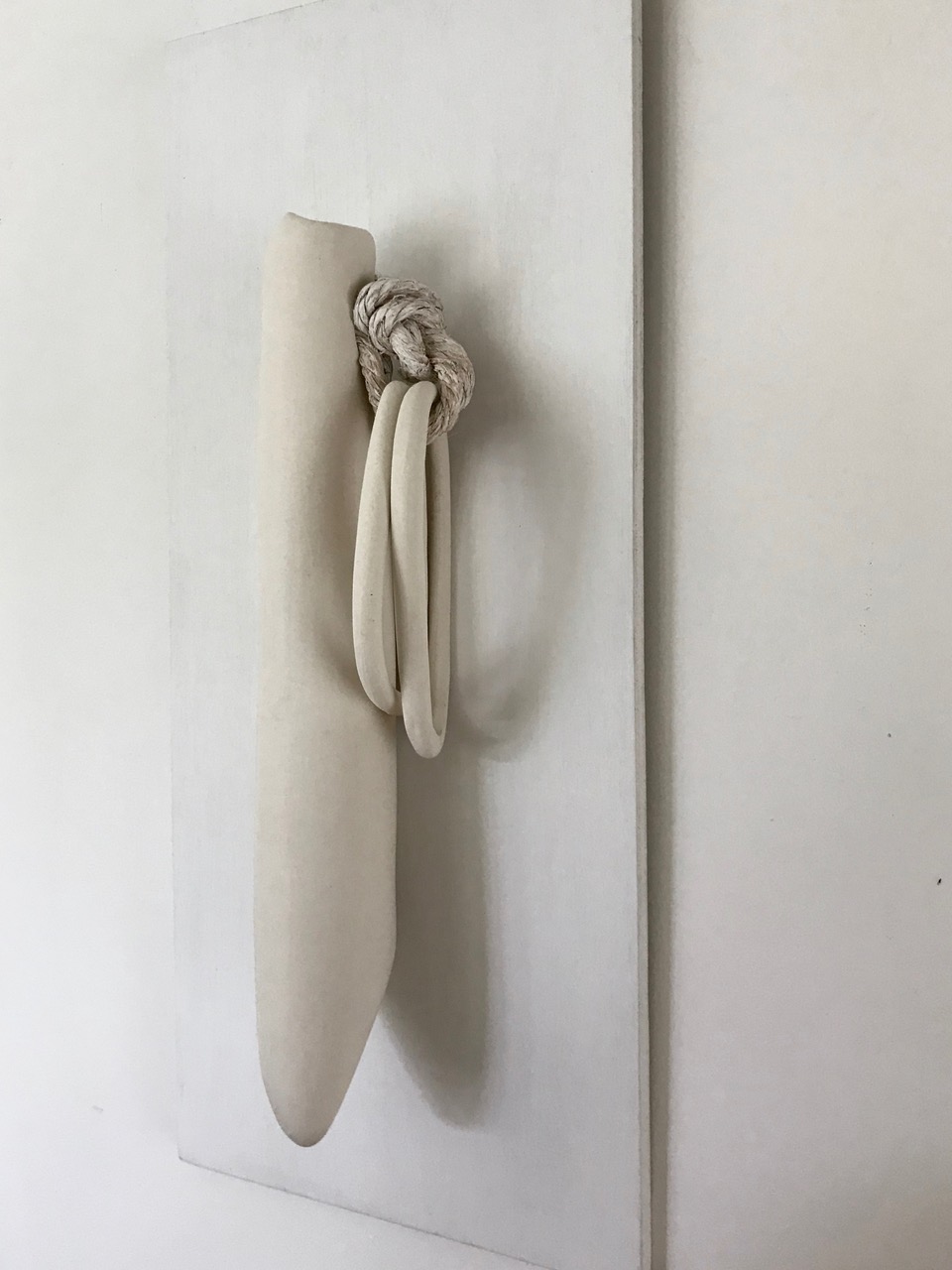 What We Carry, 2018, porcelain and rope, 23 x 10 x 4 in, $1,100
