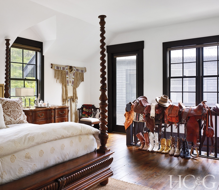 The four-poster in a guest room is from Ralph Lauren Home .