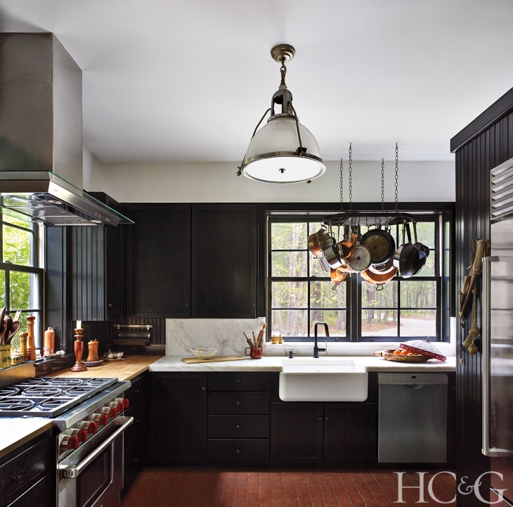 The kitchen features a Wolf range and hood.