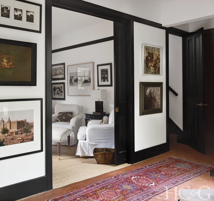 Artworks line the main hallway and study.