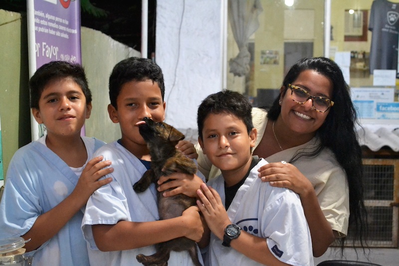 Figure 5. Volunteer Nisha with three local youth volunteers. Photo: Darwin Animal Doctors
