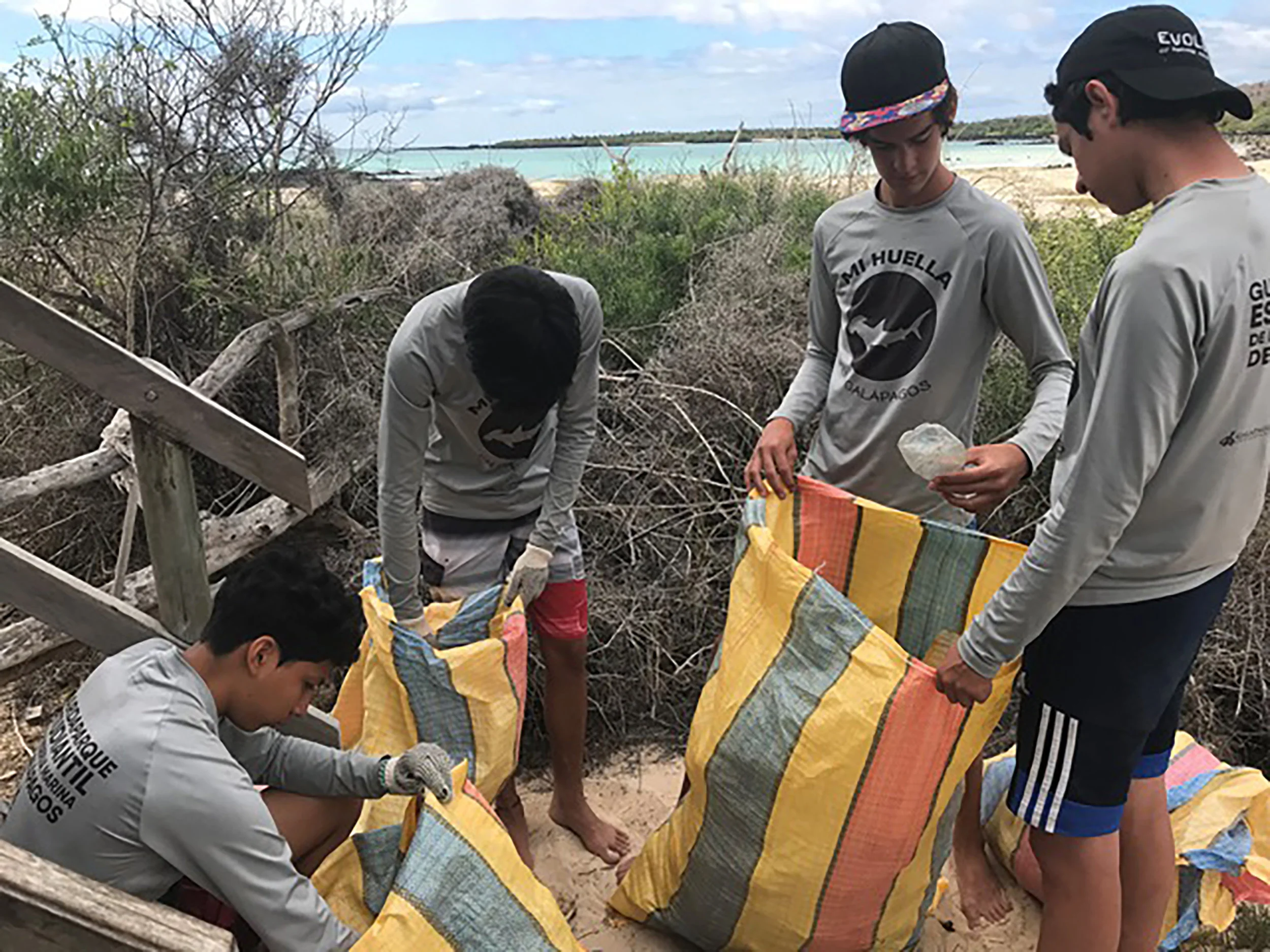 Figure 3. Local children categorizing debris from a beach clean-up for analysis. Photo: Galapagos National Park Directorate