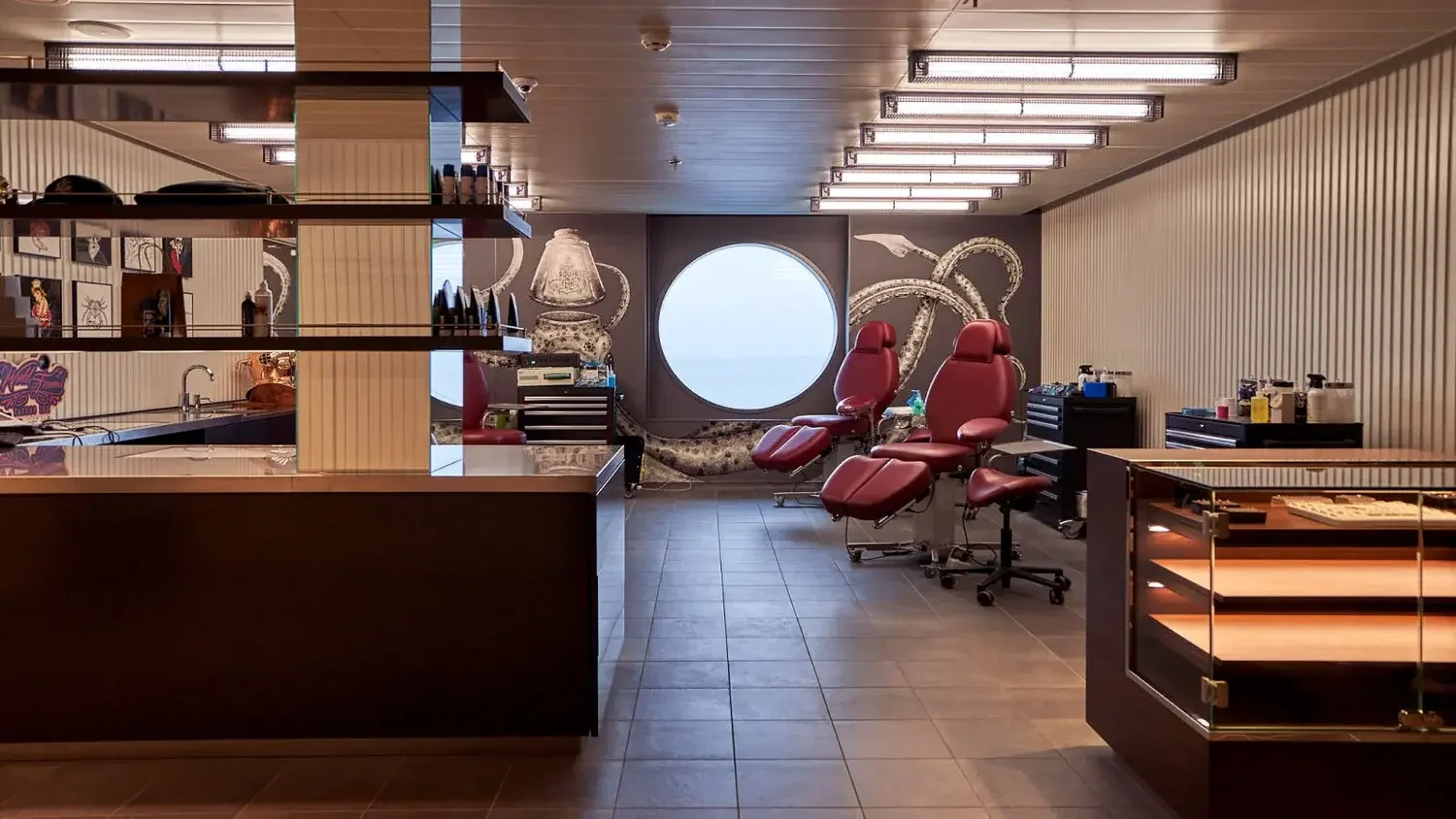 Inside the Squid Ink tattoo parlour and body piercing studio on Deck 6 of a Virgin Voyages cruise ship.