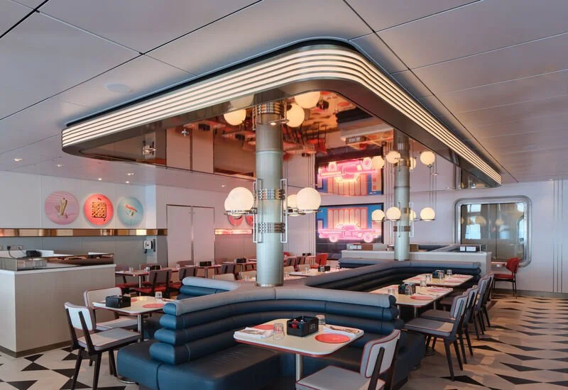 Interior shot of P&O Cruises 6th Street Diner showing seating booths and counter