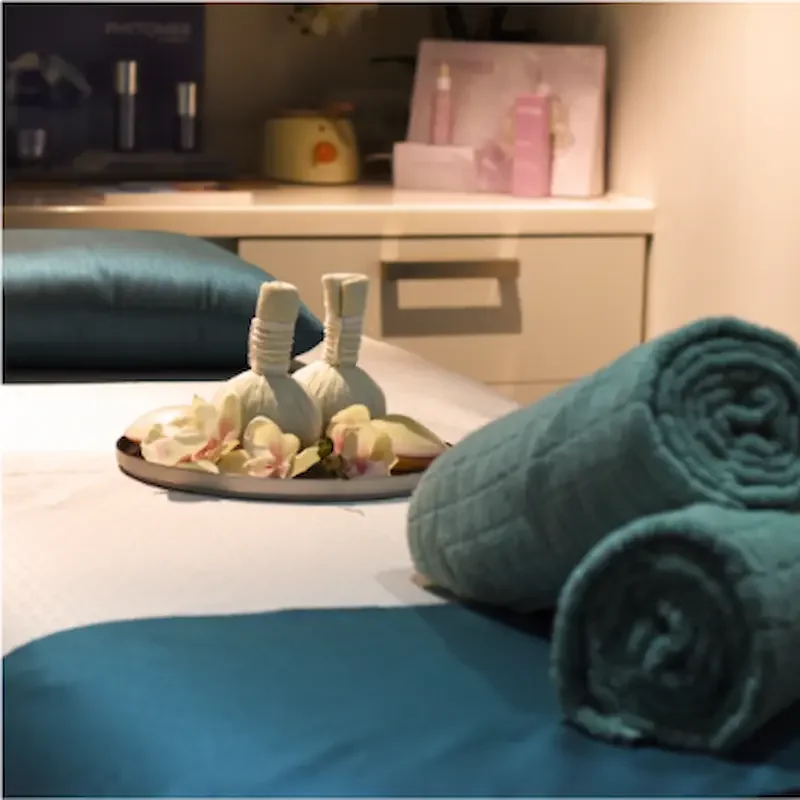 Spa treatment table with green towels