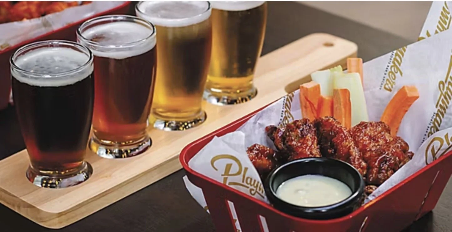 Playmakers on Freedom of of of the Seas serve burgers, chicken wings, loaded fries, nachos and other American-style bar food
