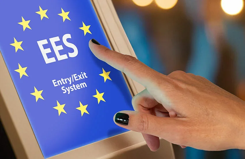 Blue EES Entry /Exit System screen with EU flag colours and gold stars