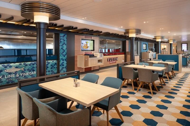 The Quays on P&O Cruises Iona showing Hook, Line and Binegar and Fusion Adion counters, and dining tables and chairs.