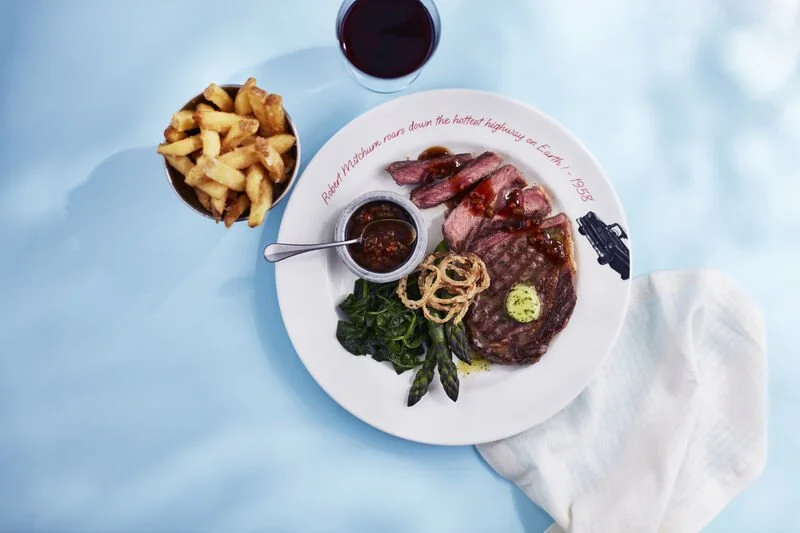 New York Strip Steak with sides including chips from 6th Street Diner on P&O Cruises Arvia