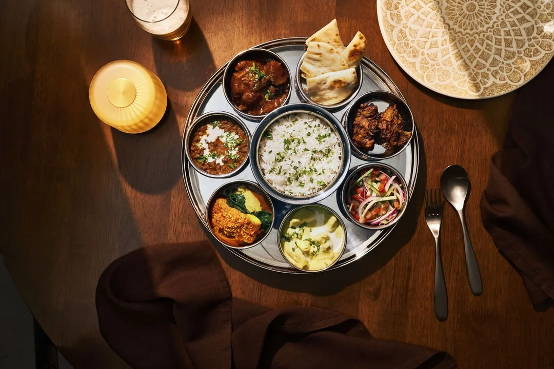 Sindhu on P&O Cruises Thali plate showing several circular dishes of Indian food.