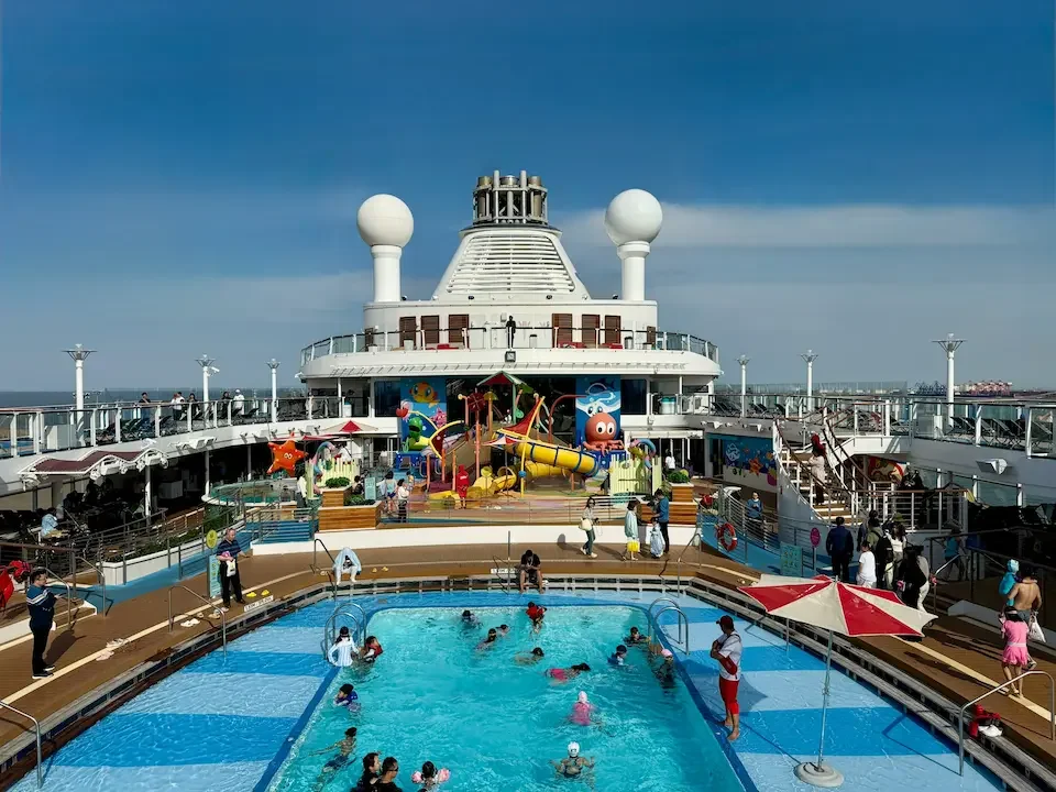 Family Pool Deck on an ocean cruise ship with children’s Waterpark.