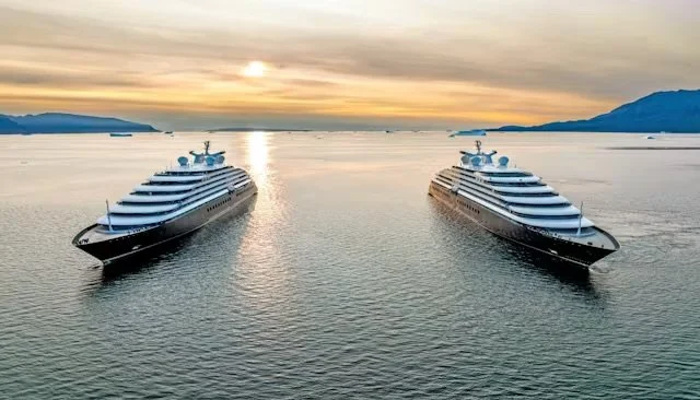 New era of luxury la jhgtaylor@outlook.com with Scenic Eclipse and Scenic Eclipse II, shown here at sea at sunset.
