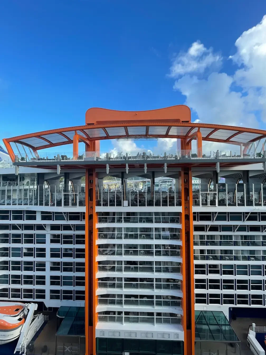 The distinctive tangerine-orange coloured Magic Carpet on Celebrity Beyond  - a cantilevered, moving platform with multiple uses.