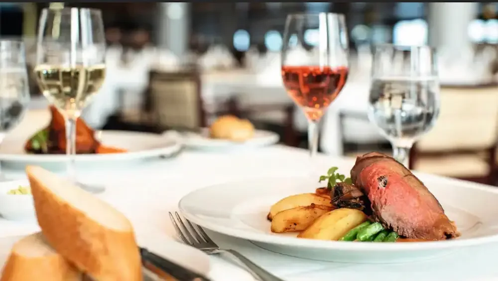 All meals and snacks are usually included on a cruise like this fine dining dinner, but drinks are extra.