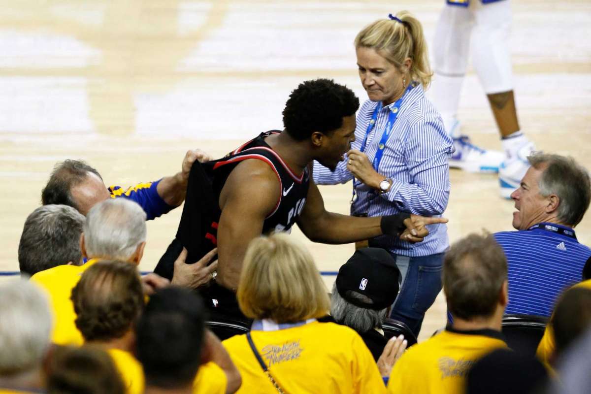 Toronto Raptors point guard Kyle Lowry pointing to Warriors minority owner Mark Stevens who shoved and cursed at Lowry for no reason during game four on the NBA finals.
