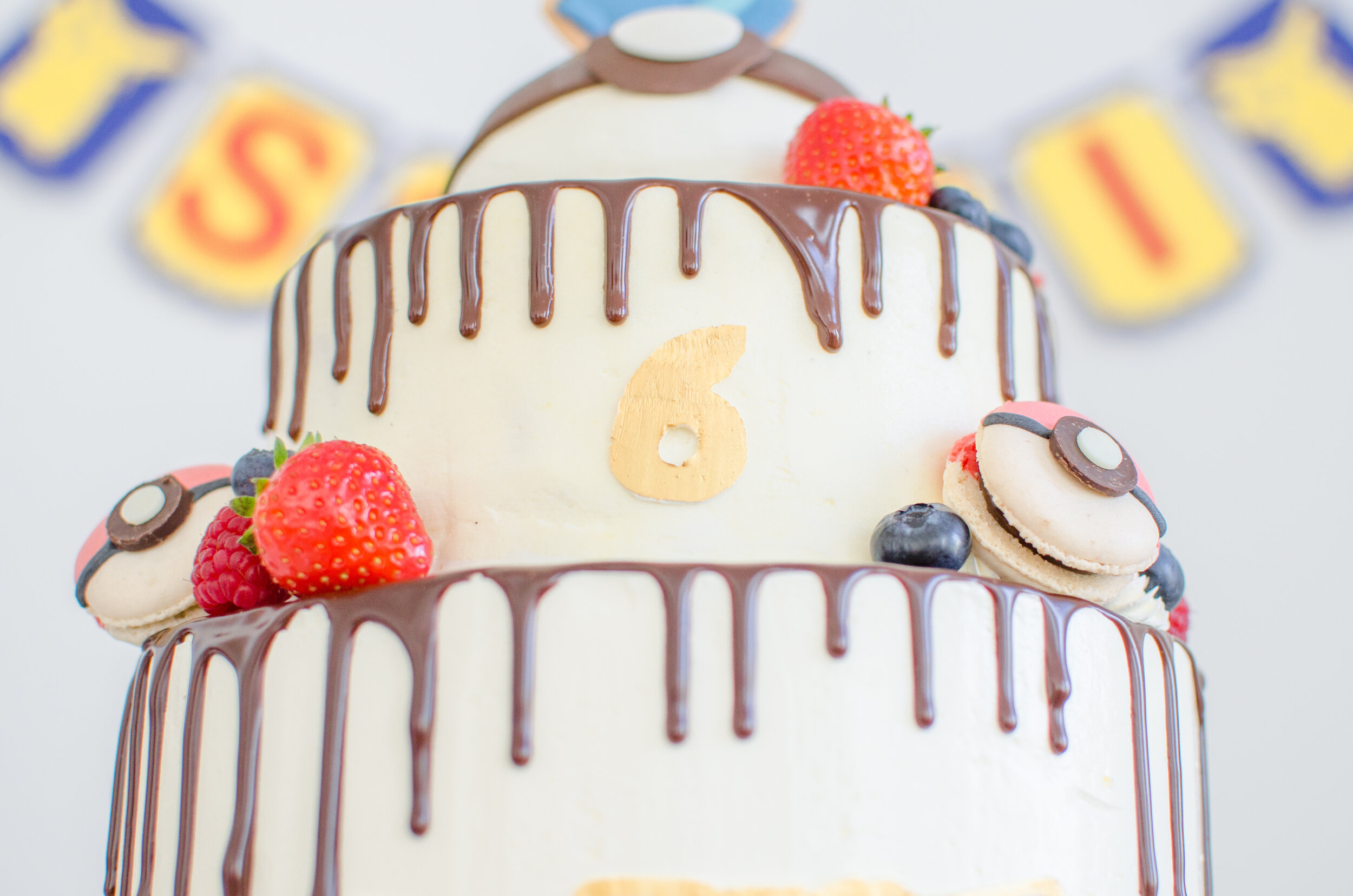 The middle tier is “Fraisier Cake” - fresh strawberries and crème mousseline.