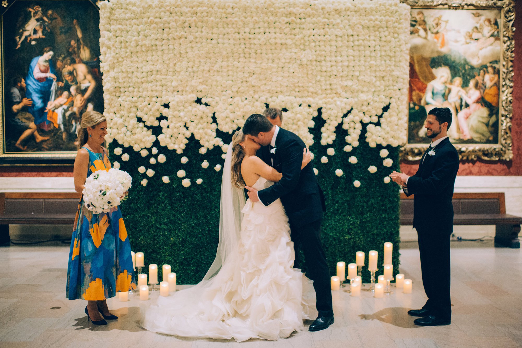 000A_MFA+Wedding+Couple+Kiss+Flower+Wall_AE+Events.jpeg.jpg.jpg
