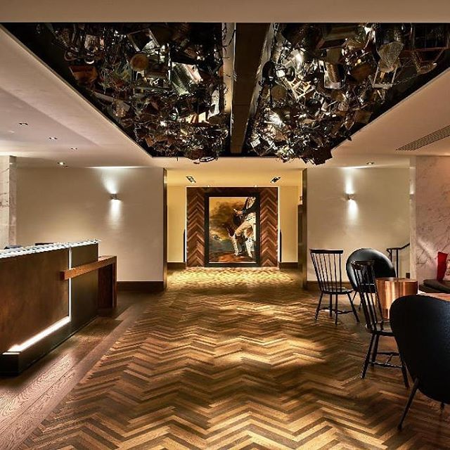 We created a custom American White Oak Herringbone in a tiny 2&quot; x 16&quot; configuration, and finished it in six different colors (mixed in the floor) for the Revere Hotel in Boston.&nbsp; Then we made a Class A fire-rated version for the wall i