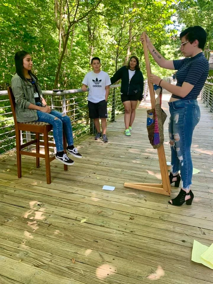 Student participants prepare their group project by interviewing one another. Photo by USFWS.