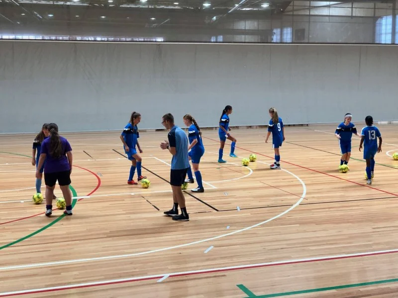 Shown here: Head Coach Pete Nowakowski working with the NSW Lightning U13s Girls side at the 2019 Futsal National Championships