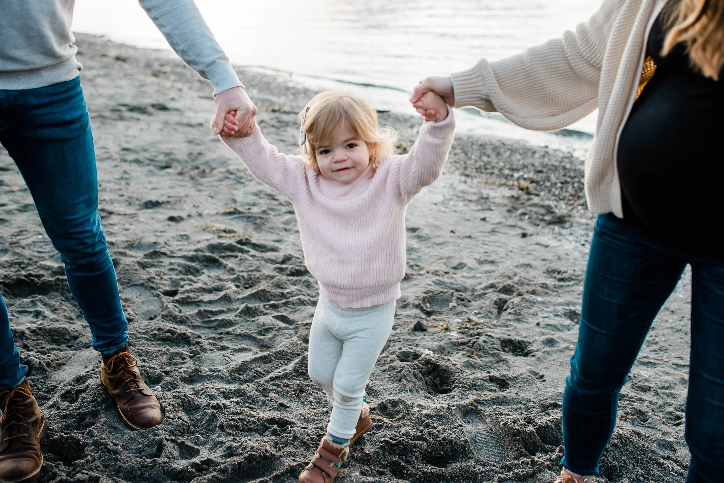seattle family at carkeek beach playing with a toddler at low tide seattle