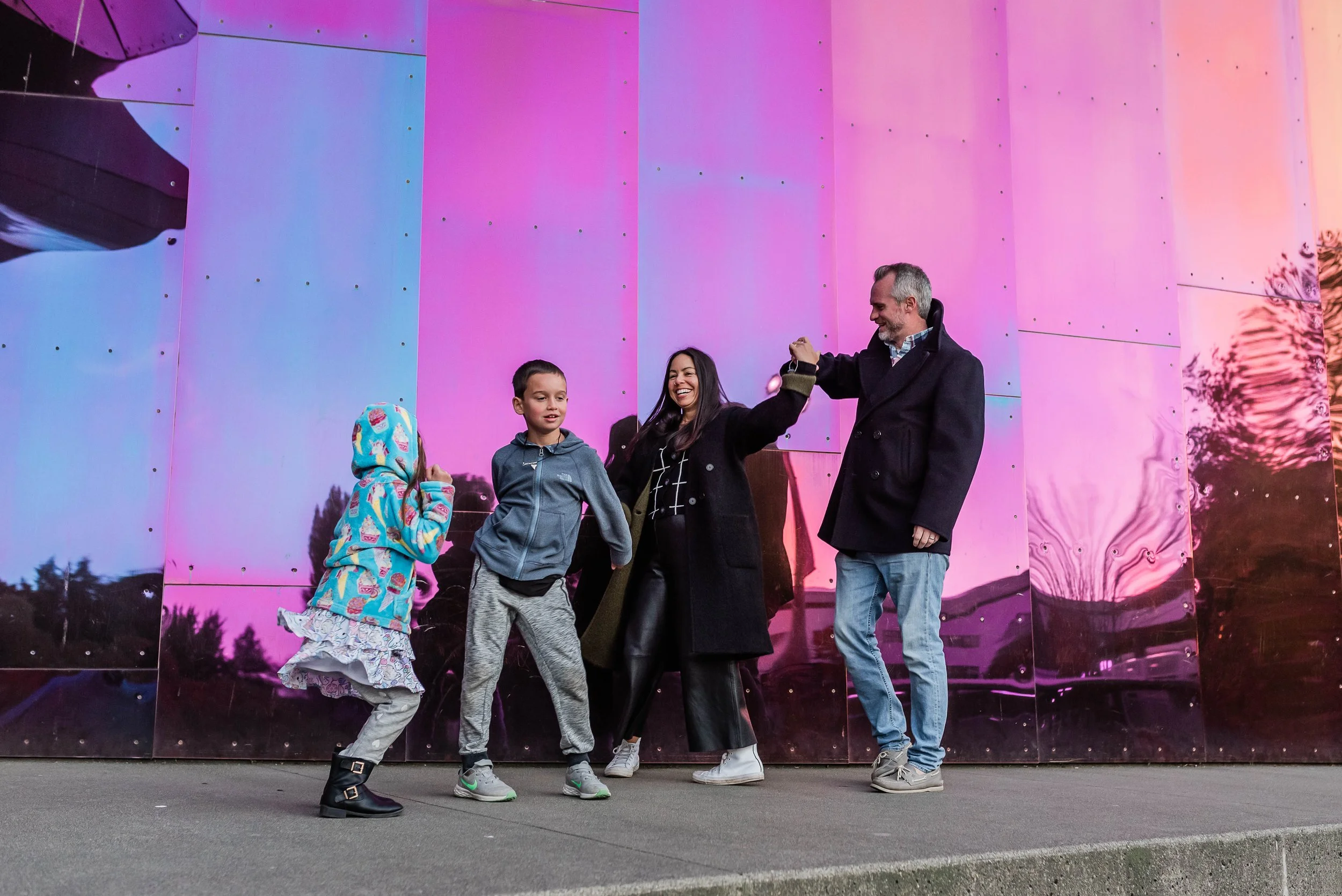 seattle family at seattle center in front of mopop museum