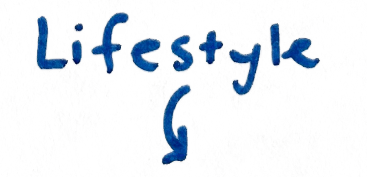 The word "LIFESTYLE" written in blue marker or pen on a light-colored background.