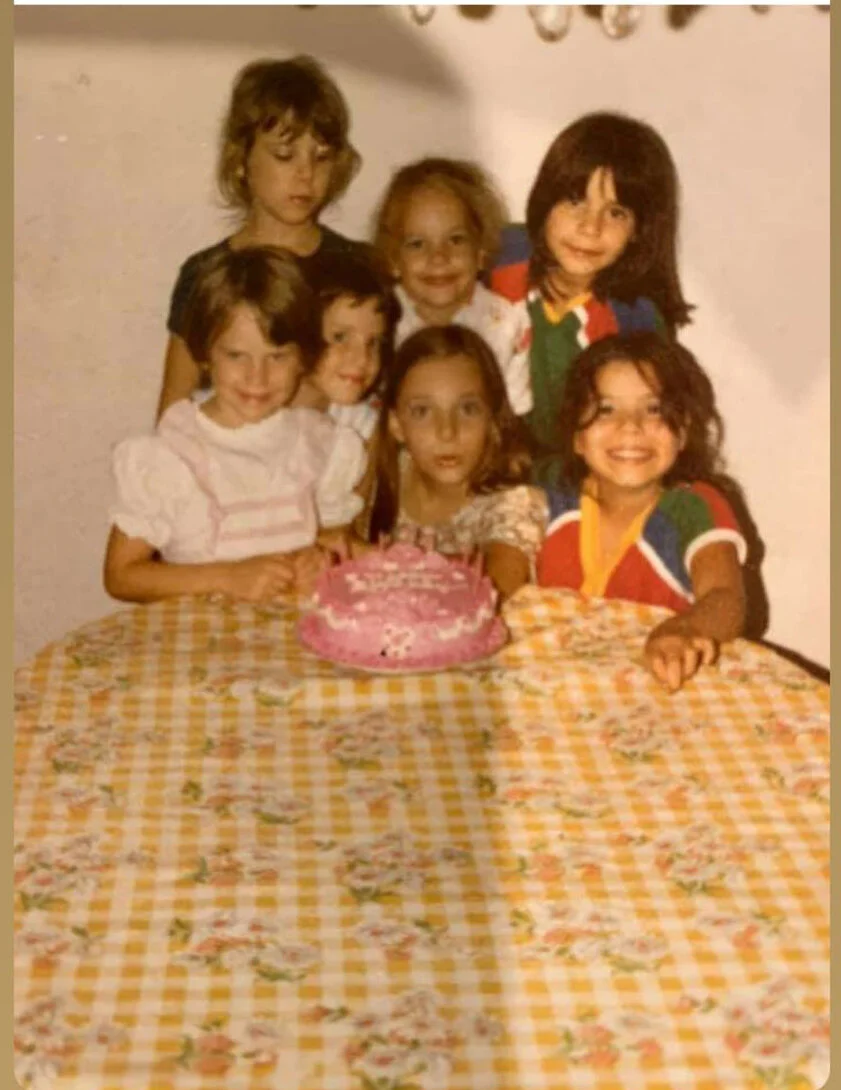My birthday circa 1981 with a pink flower cake made by my mom!