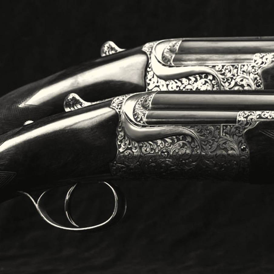 Pair of round action 12 bore over and unders.jpg