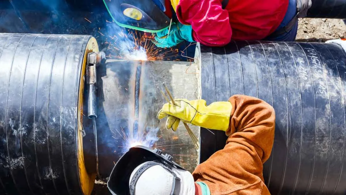 Pipe ends being welded in the firing line