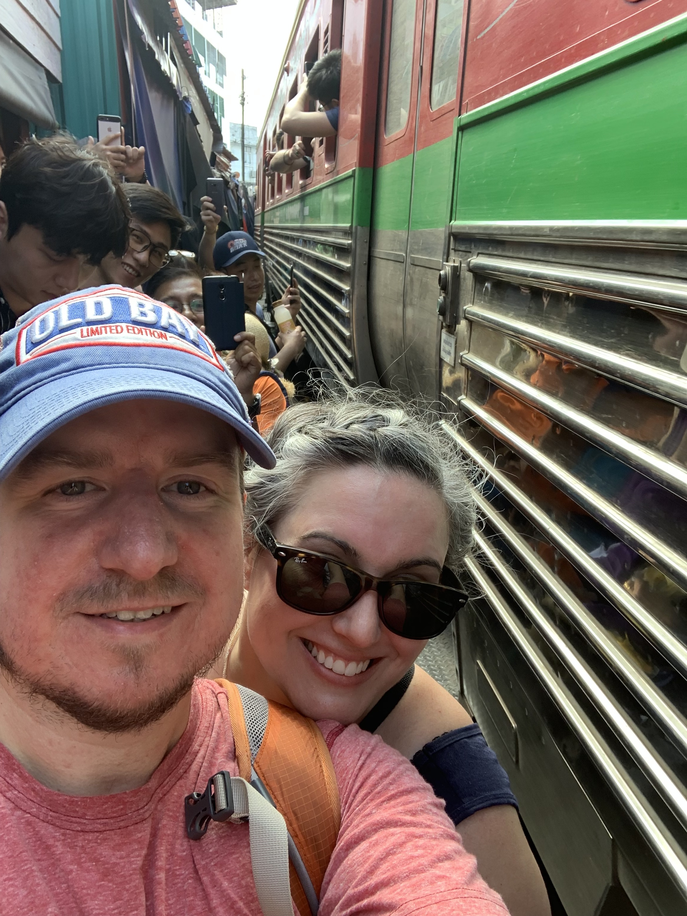 Matt and his wife, Meg, at the Maeklong Railway Market.