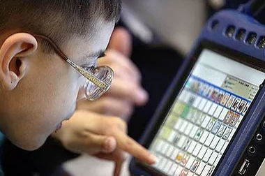 Magic Words Therapy - boy using a tablet computer.png