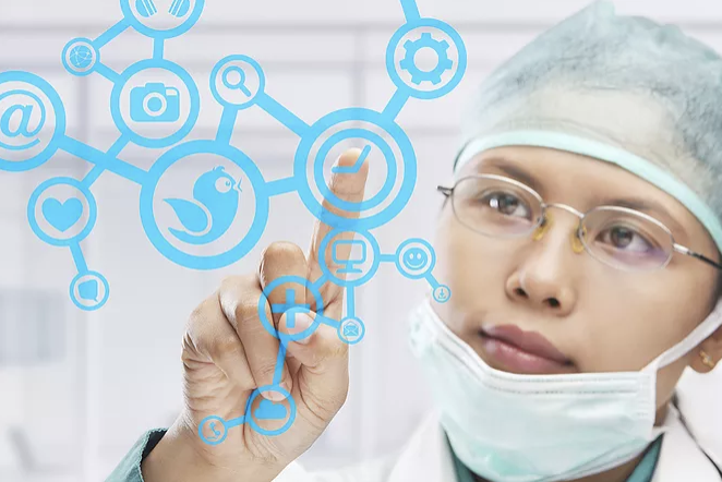 Magic Words Therapy - a female doctor using a futuristic screen displaying social media icons.png