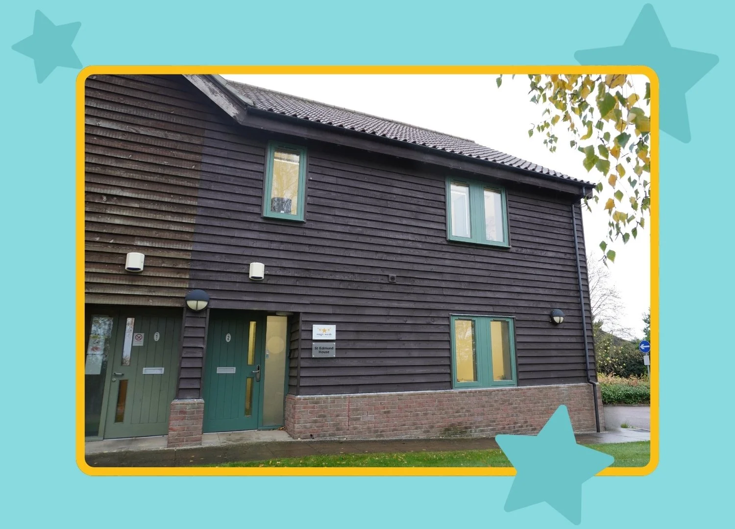 A dark brown wooden building with a green door - The Magic Words Therapy Cambridge clinic
