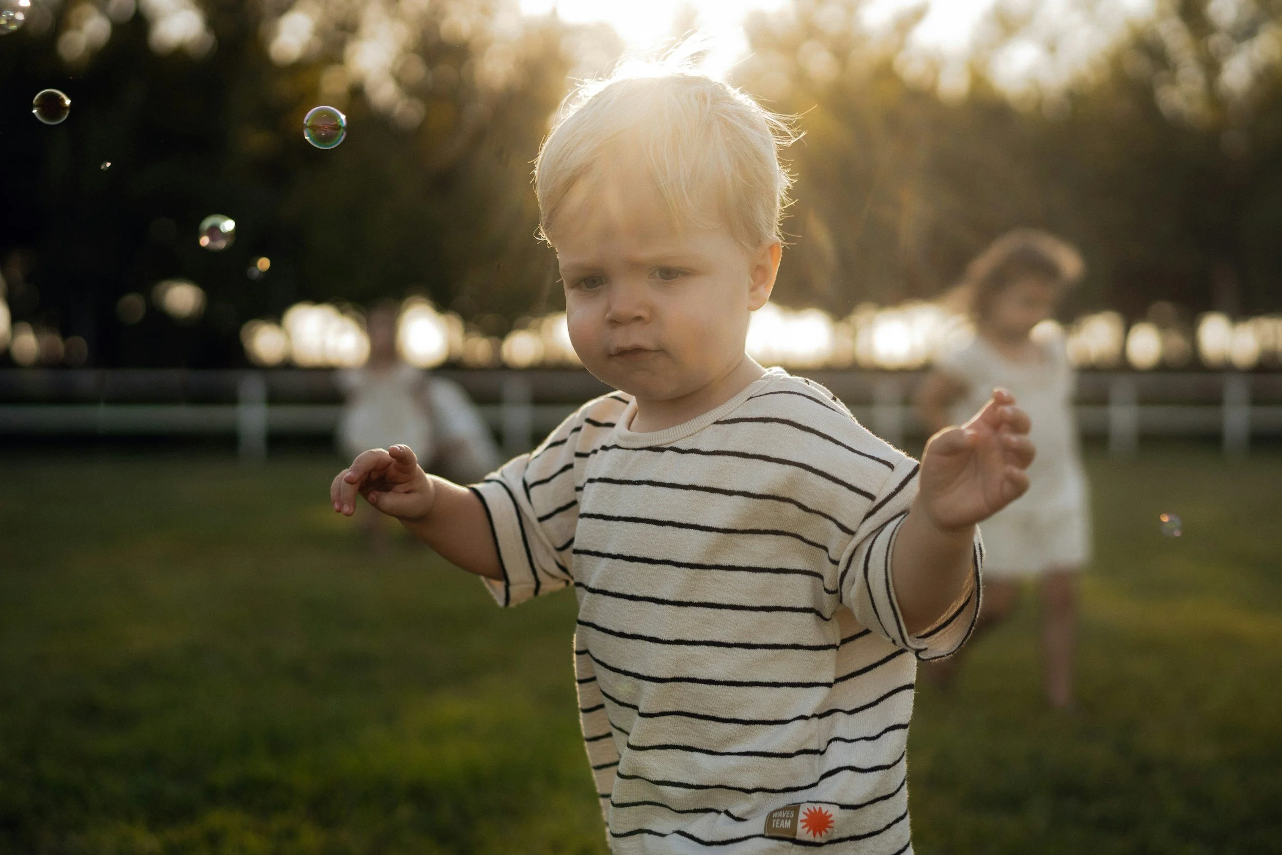 Child playing with bubbles